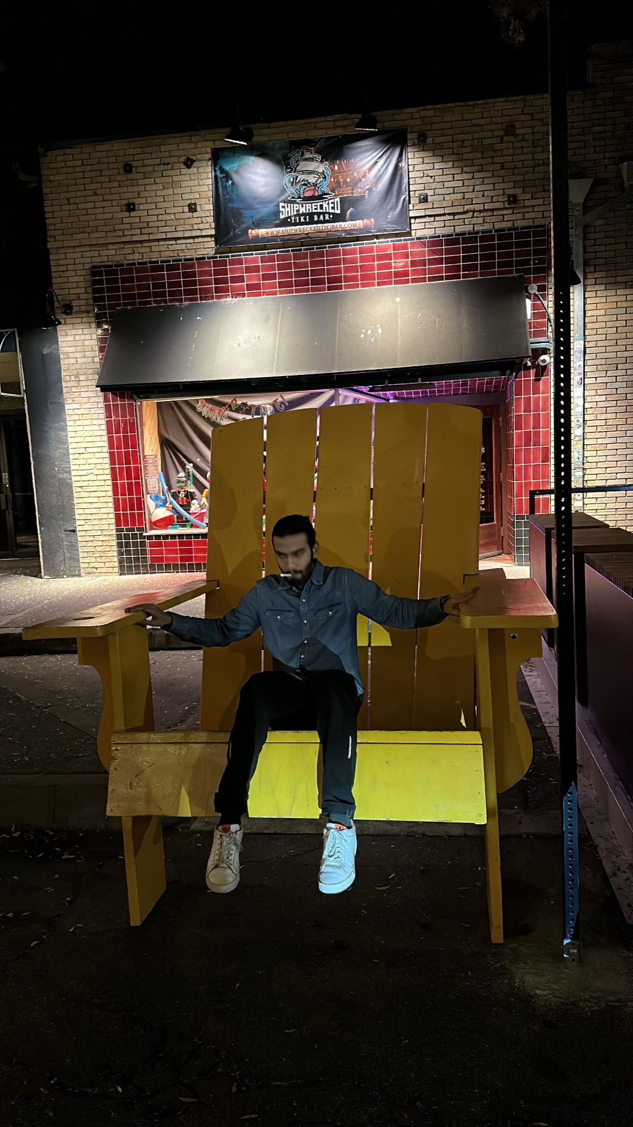 Kartikeya sitting alone on a giant yellow chair