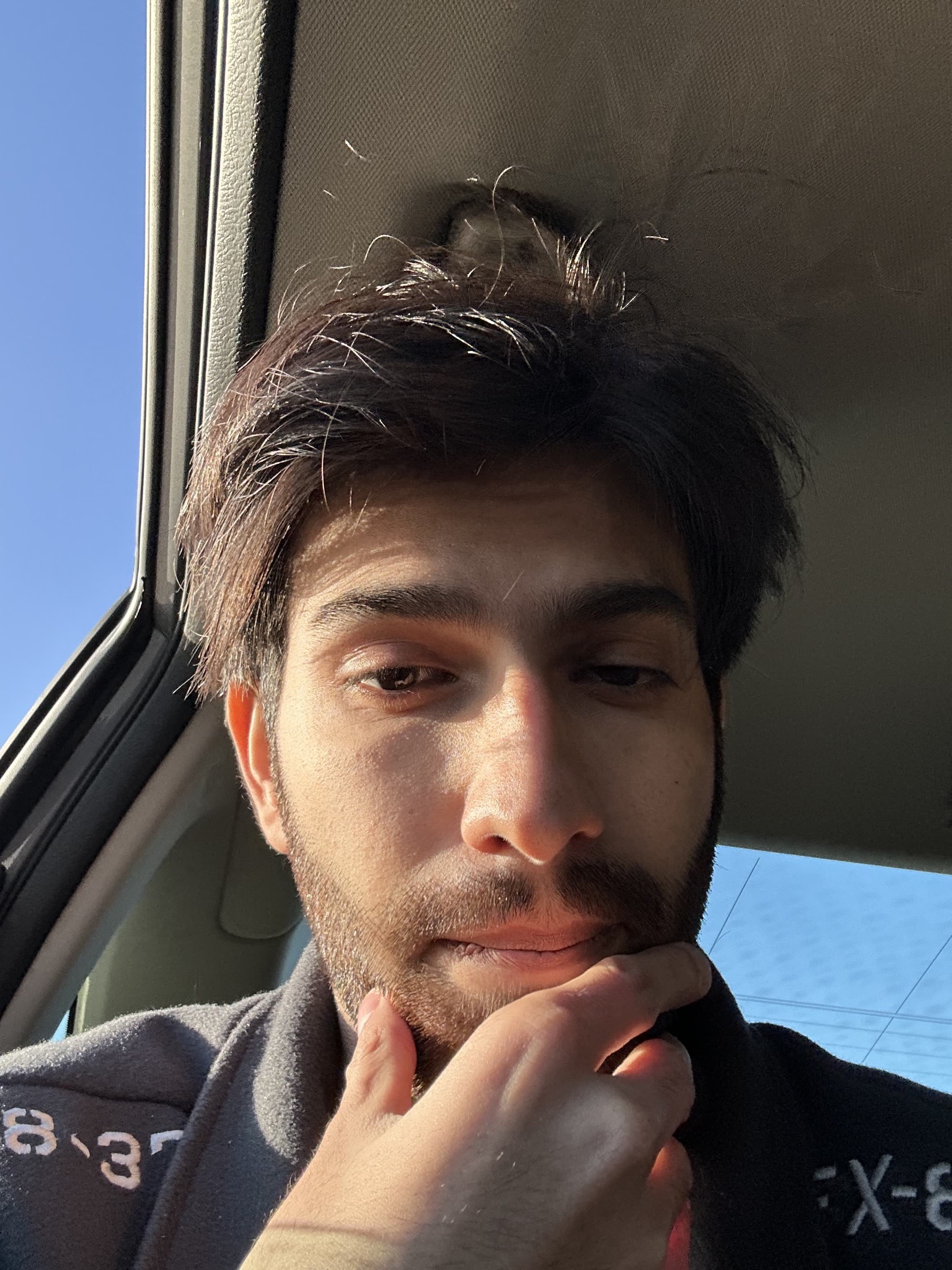 Kartikeya close-up in a car